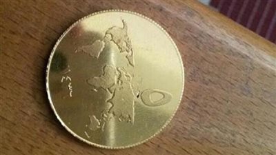 بالصور.. «داعش» يطرح عملته الذهبية في العراق