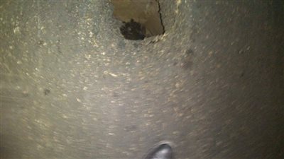 صور.. هبوط أرضي أمام كلية الهندسة بحى وسط الإسكندرية