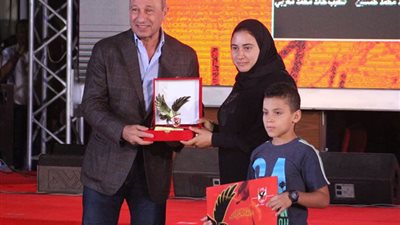 صور| تكريم زوجة الشهيد المنسي في احتفالية الأهلي بمناسبة ذكرى أكتوبر