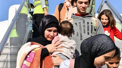 بالصور ....نحو (٩٩ )  مواطن كازاخى تم سفرهم الى الماتى بعد نجاح عملية اجلائهم